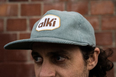 man wearing alki supply light blue snapback corduroy hat