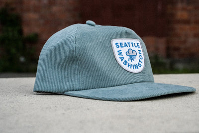 pnw hat, light blue Seattle raincloud corduroy snapback hat