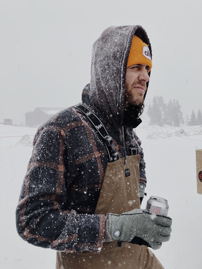 man wearing beanie in snow storm